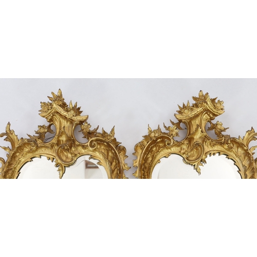 260 - A pair of 19th century carved giltwood wall mirrors in the Rococo style, of asymmetrical form with f... 