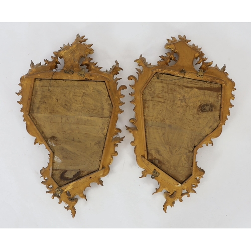 260 - A pair of 19th century carved giltwood wall mirrors in the Rococo style, of asymmetrical form with f... 