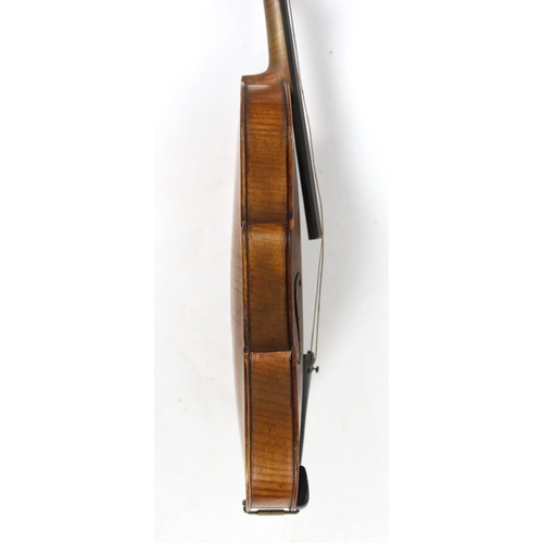 28 - An Italian violin, 2nd half 19th century, with medium colour to the two-piece back sides and neck, r... 