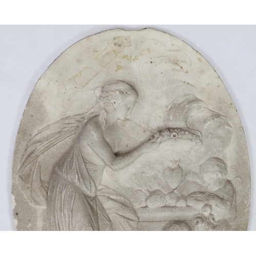 31 - An 18th century French carved white marble relief plaque, depicting a classical maiden holding a flo... 