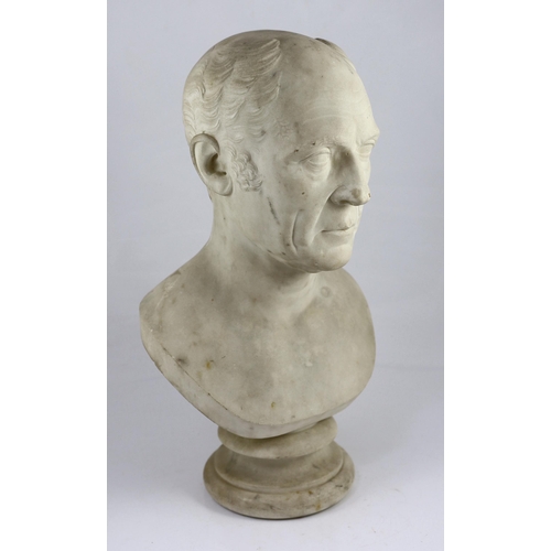 32 - A carved white marble bust of a gentleman, second quarter 19th century, on a turned socle, 30cm wide... 