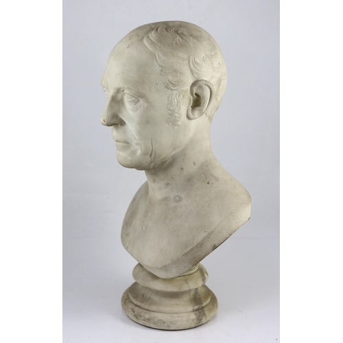 32 - A carved white marble bust of a gentleman, second quarter 19th century, on a turned socle, 30cm wide... 