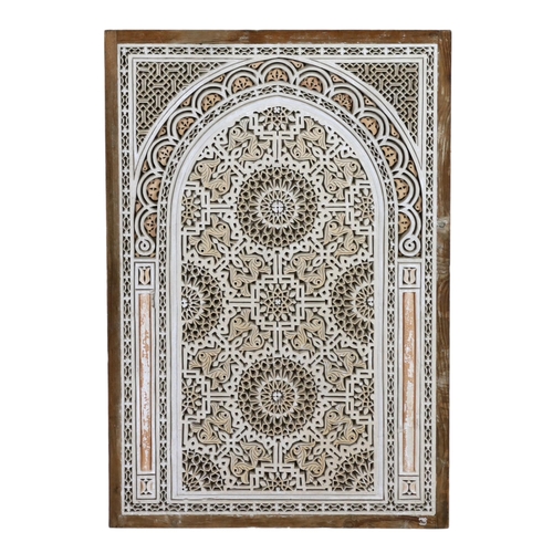 35 - A Hispano Moresque carved marble panel, of arched form with roundel and stylised foliate motifs, hou... 