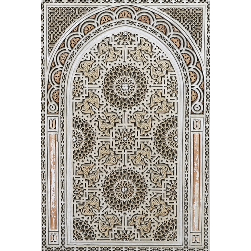 35 - A Hispano Moresque carved marble panel, of arched form with roundel and stylised foliate motifs, hou... 