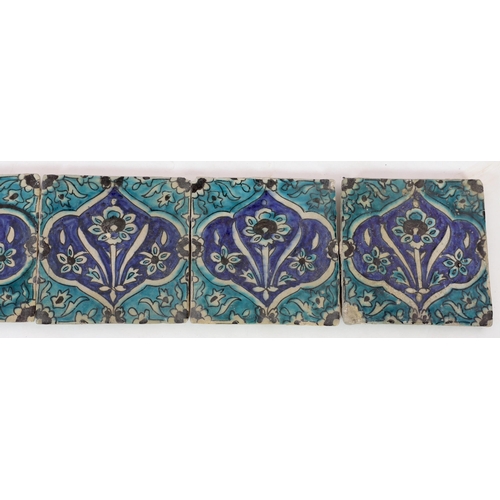 36 - A set of five Persian fritware tiles, Qajar dynasty, 19th century, each decorated in turquoise, blue... 