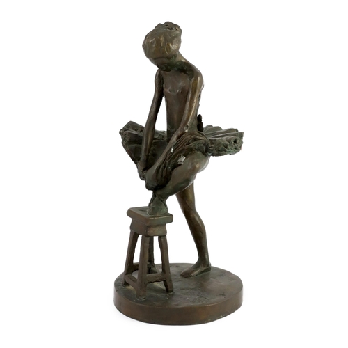 49 - Sidney Beck (SA, b.1936). A limited edition bronze figure of a ballerina tying her shoe, signed in t... 