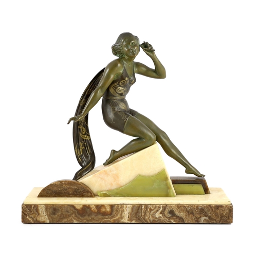 58 - A French Art Deco bronzed spelter and marble figure of a bathing beauty, kneeling with a seashell he... 