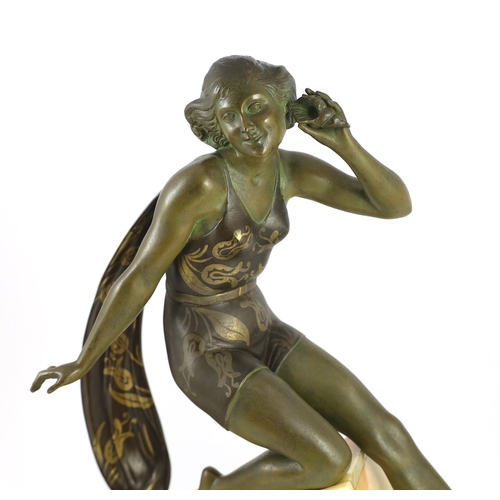 58 - A French Art Deco bronzed spelter and marble figure of a bathing beauty, kneeling with a seashell he... 