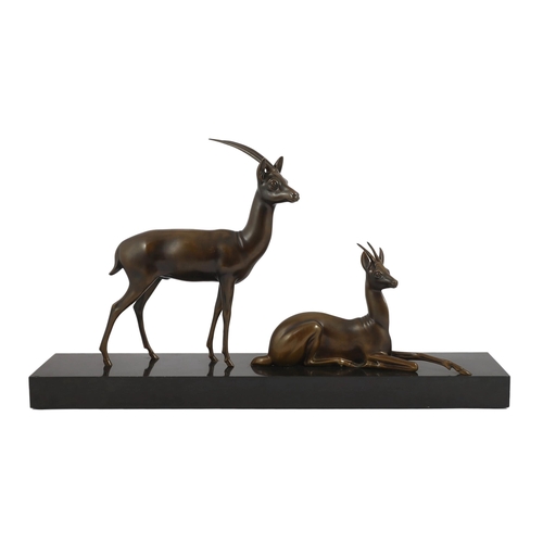 60 - Georgij Dmitrievic Lavroff (Russian, 1895-1991). An Art Deco bronze group of two antelope, on black ... 