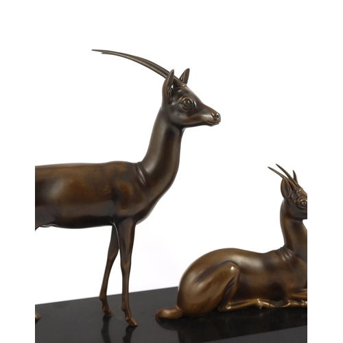 60 - Georgij Dmitrievic Lavroff (Russian, 1895-1991). An Art Deco bronze group of two antelope, on black ... 