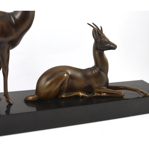 60 - Georgij Dmitrievic Lavroff (Russian, 1895-1991). An Art Deco bronze group of two antelope, on black ... 