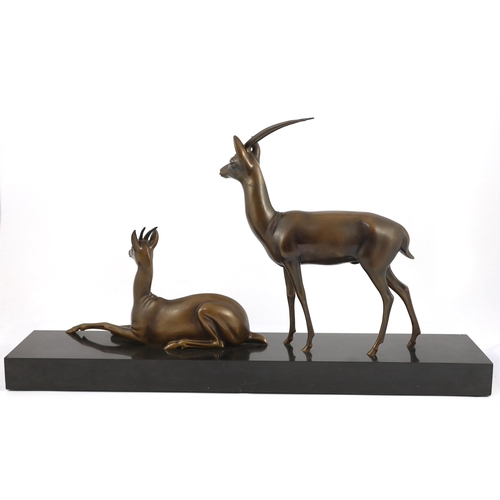 60 - Georgij Dmitrievic Lavroff (Russian, 1895-1991). An Art Deco bronze group of two antelope, on black ... 