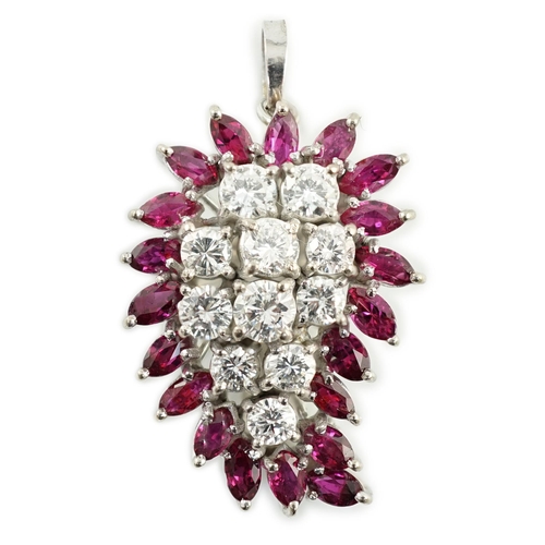 634 - A modern white gold, ruby and diamond set pear shaped cluster pendant, set with eleven round cut dia... 