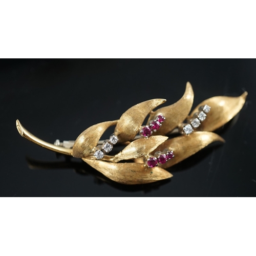 638 - A 1960's 18ct gold, six stone ruby and seven stone diamond chip set leaf spray brooch, 55mm, gross w... 