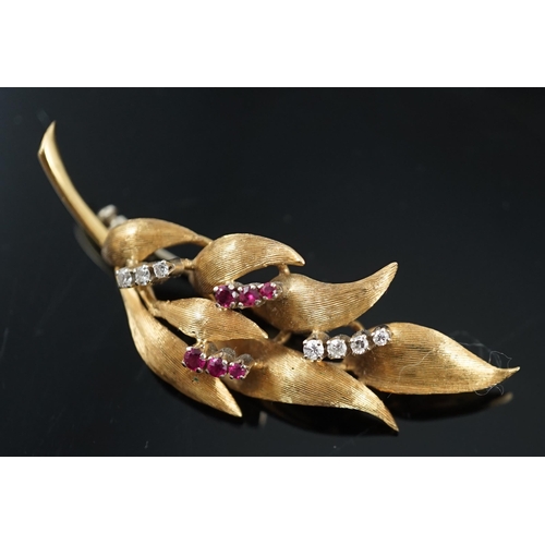 638 - A 1960's 18ct gold, six stone ruby and seven stone diamond chip set leaf spray brooch, 55mm, gross w... 