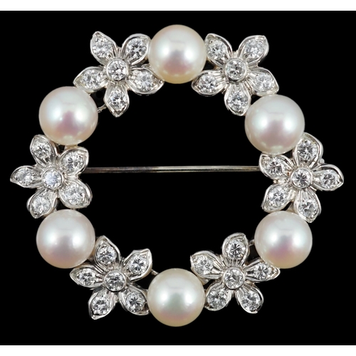 642 - A late 20th century white gold cultured pearl and diamond cluster set openwork circular brooch, with... 