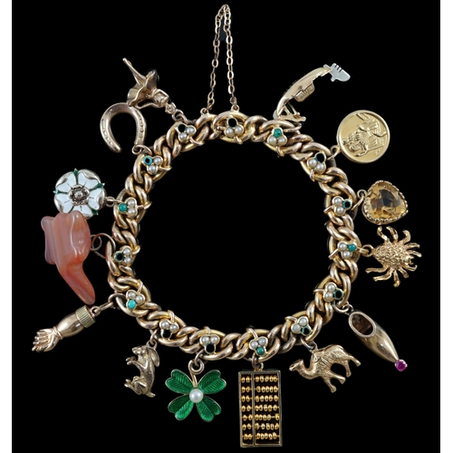 643 - An Edwardian 15ct gold, seed pearl and turquoise set curb link charm bracelet, the links with shamro... 