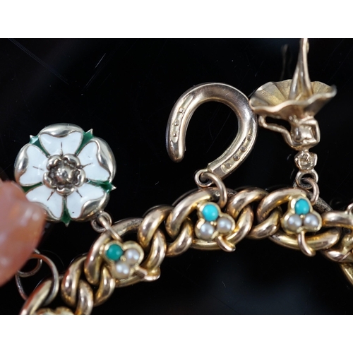 643 - An Edwardian 15ct gold, seed pearl and turquoise set curb link charm bracelet, the links with shamro... 