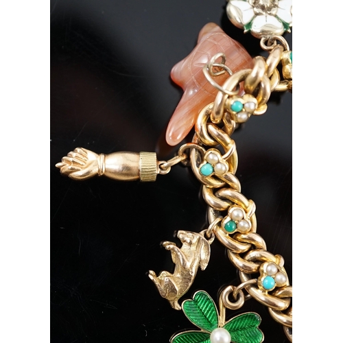 643 - An Edwardian 15ct gold, seed pearl and turquoise set curb link charm bracelet, the links with shamro... 