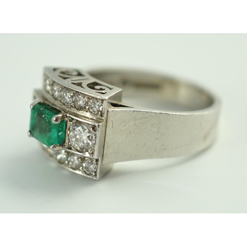 646 - A Swedish 18k gold, single stone emerald and fourteen stone diamond set three row cluster ring, the ... 