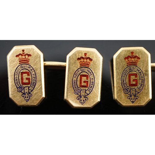 647 - A pair of 1920's/1930's Cartier gold and two colour enamel rectangular Regimental cufflinks, with ca... 