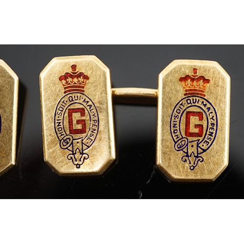 647 - A pair of 1920's/1930's Cartier gold and two colour enamel rectangular Regimental cufflinks, with ca... 