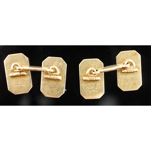 647 - A pair of 1920's/1930's Cartier gold and two colour enamel rectangular Regimental cufflinks, with ca... 