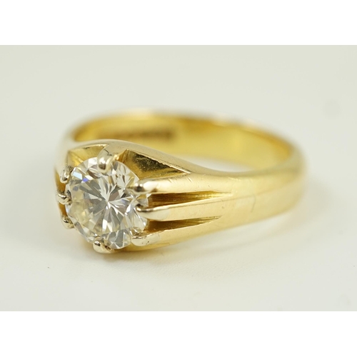 655 - A modern 18ct gold and claw set solitaire diamond ring, the round brilliant cut stone weighing 1.33c... 