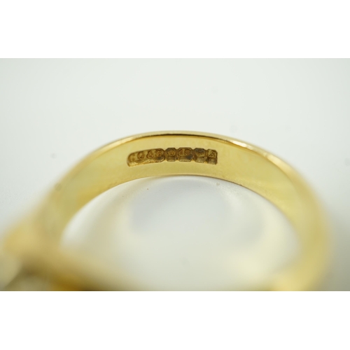 655 - A modern 18ct gold and claw set solitaire diamond ring, the round brilliant cut stone weighing 1.33c... 