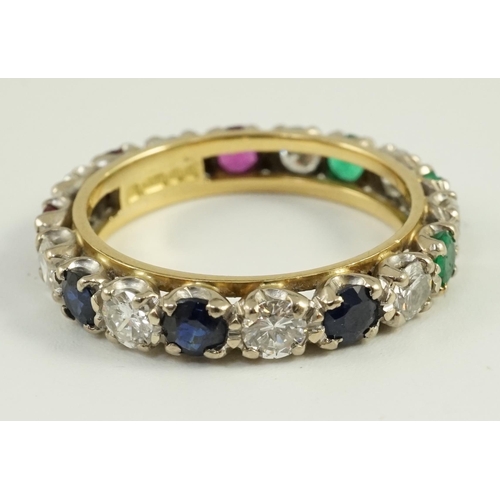 656 - A modern 18ct gold, ruby, sapphire, emerald and diamond set full eternity ring, size O/P, gross weig... 