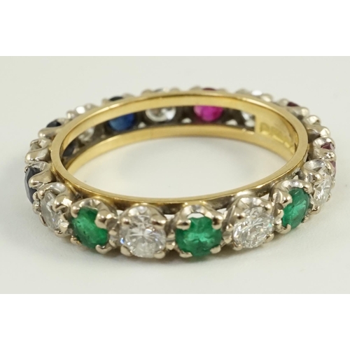 656 - A modern 18ct gold, ruby, sapphire, emerald and diamond set full eternity ring, size O/P, gross weig... 