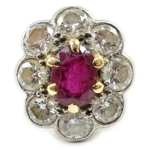 659 - An 18ct gold, claw set single stone ruby and eight stone collet set diamond oval cluster ring, size ... 