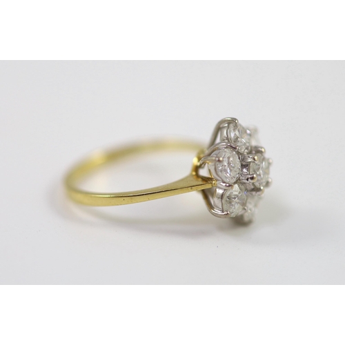 661 - A modern 18ct gold and seven stone diamond set flower head cluster ring, size M/N, gross weight 3.8 ... 