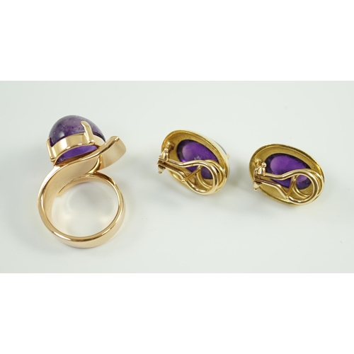 663 - A modern gold and cabochon oval amethyst set dress ring and a pair of similar earrings, ring size I,... 