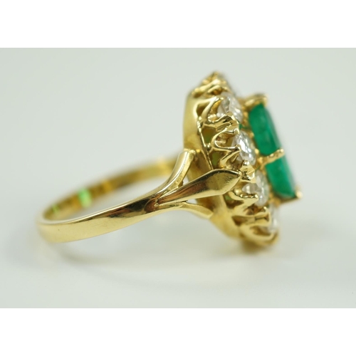 665 - A modern 18ct gold, emerald and diamond set oval cluster ring, size N, gross weight 7.5 grams.... 