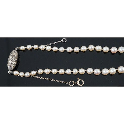 667 - A single strand graduated natural saltwater pearl necklace, with AnchorCert report dated 31st March,... 