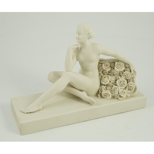 70 - Henri Désiré Grisard (1872 - active until 1940). A signed bisque model of a seated nude by flowers, ... 