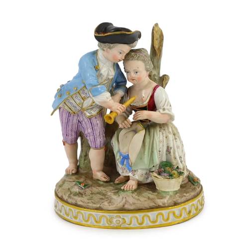 79 - A Meissen group of a boy and a girl with a piccolo, 19th century, the oval base modelled with two tr... 