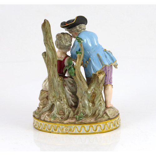 79 - A Meissen group of a boy and a girl with a piccolo, 19th century, the oval base modelled with two tr... 