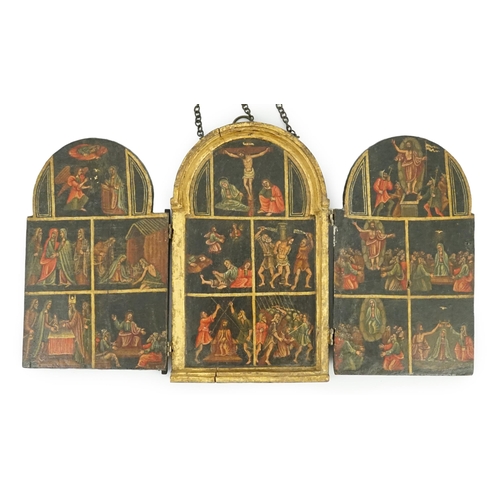 11 - A 17th century triptych case, oil on wood, Icon depicting the life of Christ, with a Saint receiving... 