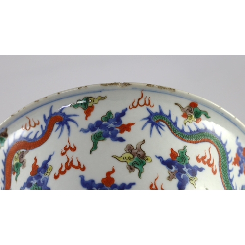 120 - A Chinese doucai 'dragon' deep bowl, 19th century, the interior painted with a confronting five claw... 