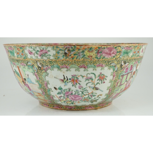 122 - A large Chinese Canton (Guangzhou) decorated famille rose bowl, c.1830-50, typically painted to pane... 