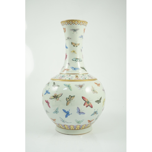 124 - A Chinese famille rose butterfly vase, Guangxu mark, finely painted with scattered butterflies, ir... 