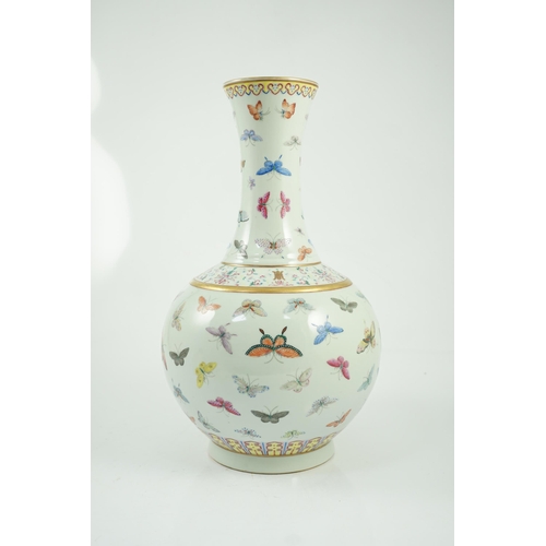 124 - A Chinese famille rose butterfly vase, Guangxu mark, finely painted with scattered butterflies, ir... 