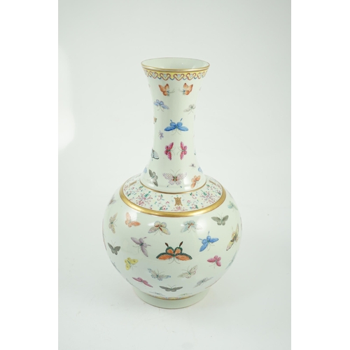 124 - A Chinese famille rose butterfly vase, Guangxu mark, finely painted with scattered butterflies, ir... 