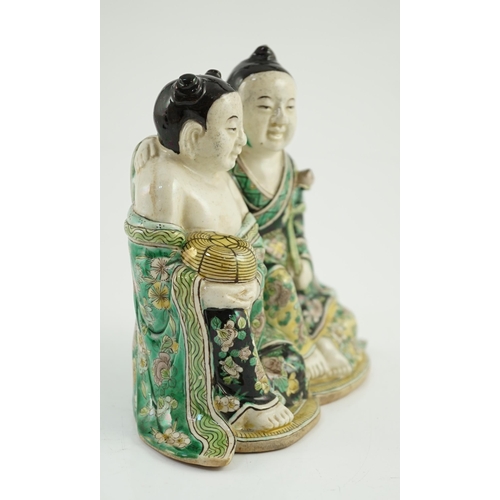 125 - A Chinese famille verte enamelled biscuit group of the Hehe Erxian, possibly 19th century, one figur... 