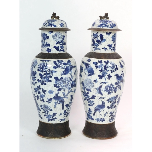 128 - A pair of large Chinese blue and white crackle glaze vases and covers, late 19th century, each paint... 