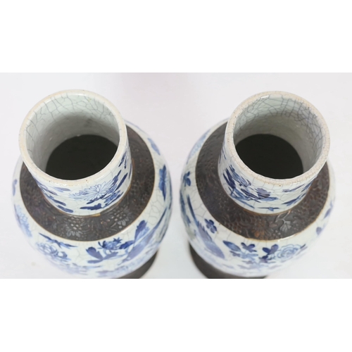 128 - A pair of large Chinese blue and white crackle glaze vases and covers, late 19th century, each paint... 