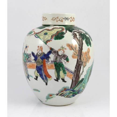 131 - A large Chinese famille verte ovoid jar and cover, 19th century, finely painted with dignitaries mee... 