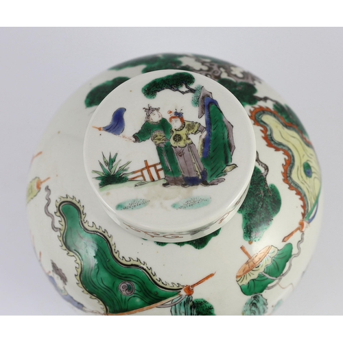 131 - A large Chinese famille verte ovoid jar and cover, 19th century, finely painted with dignitaries mee... 